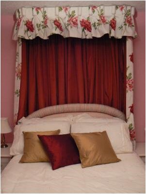 Decorative drapes on a Half Tester